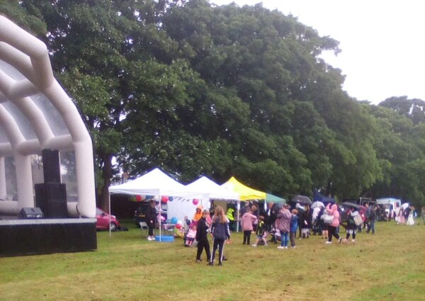 Picture of the Main Stage and surrounding stalls with crowd from the Bletchley Big Lunch Platinum Jubilee