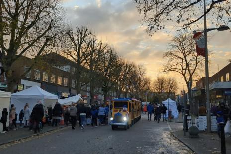 Photo of Bletchley high street with market stalls and festive train ride in the centre