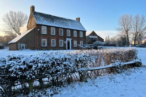 Image of Sycamore House covered in snow