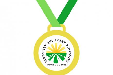 Image of medal with town council's logo