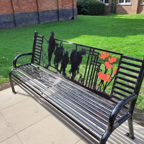Photo of war memorial bench with soldiers